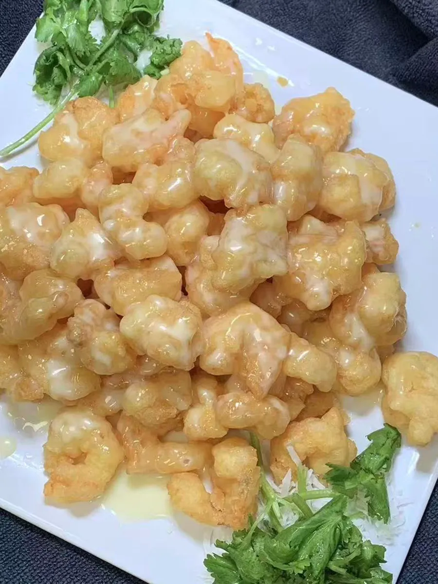 Crispy shrimp with creamy sauce and cilantro garnish at Kungfu Rice, a Chinese Fast Food Restaurant in Savannah