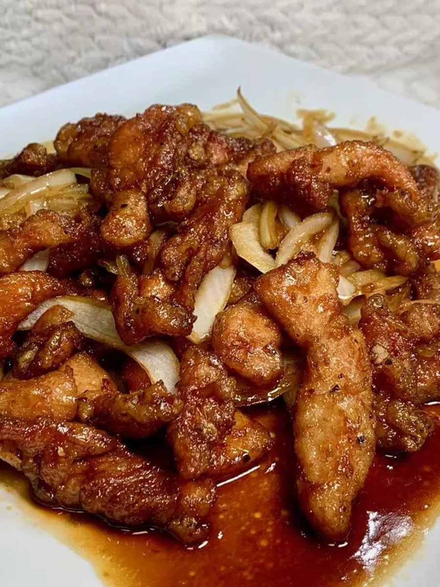 Stir-fried pork with onions in savory brown sauce at Kungfu Rice, a Chinese Fast Food Restaurant in Savannah