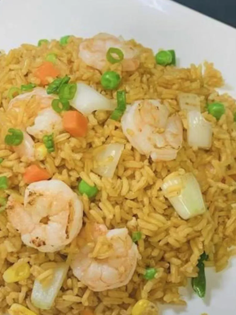 Shrimp fried rice with mixed vegetables on white plate at Kungfu Rice, a Chinese Fast Food Restaurant in Savannah